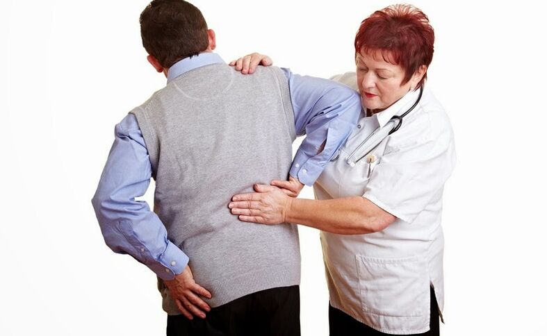 Examination of the patient by the doctor for back pain